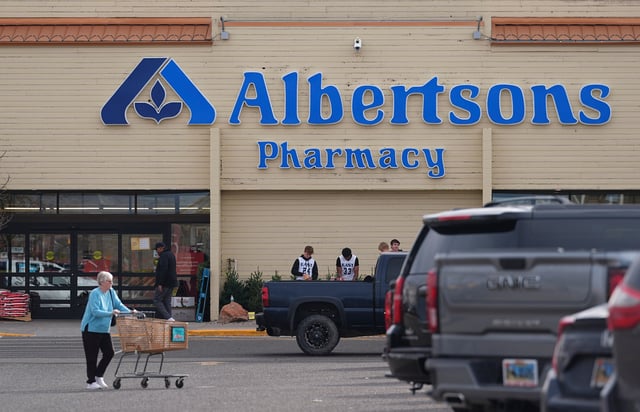 FILE - Shoppers head into an Albertson's grocery store Nov. 23, 2024, in Cheyenne, Wyo. (AP Photo/David Zalubowski, File)