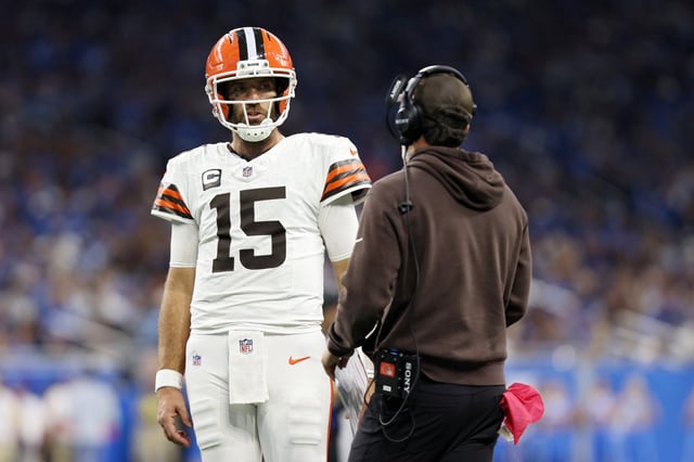 Head coach Kevin Stefanski of the Cleveland Browns speaks with Joe Flacco #15 of the Cleveland Browns during the third quarter against the Detroit Lions  at Ford Field on September 28, 2025 in Detroit, Michigan.
