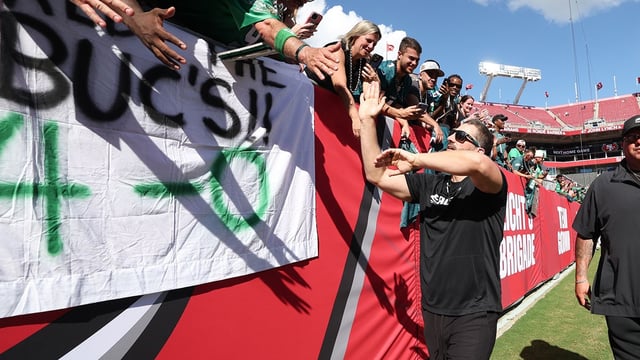 Sep 28, 2025; Tampa, Florida, USA; Philadelphia Eagles head coach Nick Sirianni high fives fans after the game against the Tampa Bay Buccaneers at Raymond James Stadium. Mandatory Credit: Nathan Ray Seebeck-Imagn Images