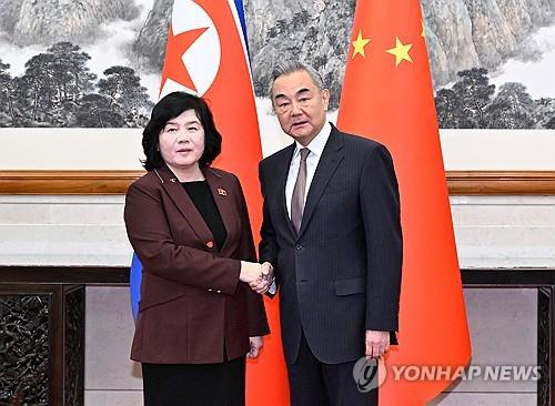 This Associated Press photo shows North Korean Foreign Minister Choe Son-hui shaking hands with Chinese Foreign Minister Wang Yi during their talks in Beijing on Sept. 28, 2025. (Yonhap)