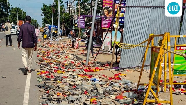 Footwear and other belongings of people, who attended the rally of actor and Tamilaga Vetri Kazhagam (TVK) chief Vijay, lie on a road in the aftermath of a stampede during the rally, in Karur district, Tamil Nadu, Sunday, Sept. 28, 2025. (PTI Photo)
