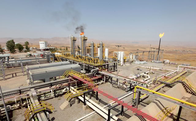 A flame rises from a chimney of an oil field in Iraq's Kurdistan region, August 16, 2014. REUTERS/Azad Lashkari/File Photo