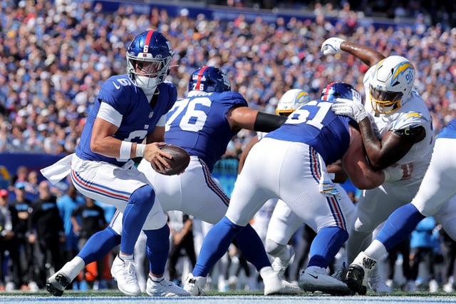 Sep 28, 2025; East Rutherford, New Jersey, USA; New York Giants quarterback Jaxson Dart (6) takes a snap against the Los Angeles Chargers during the first quarter at MetLife Stadium. Mandatory Credit: Brad Penner-Imagn Images