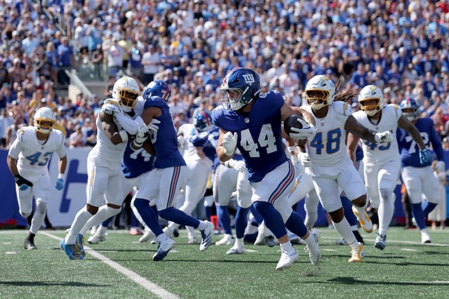 Sep 28, 2025; East Rutherford, New Jersey, USA; New York Giants running back Cam Skattebo (44) runs with the ball against the Los Angeles Chargers during the second quarter at MetLife Stadium. Mandatory Credit: Brad Penner-Imagn Images