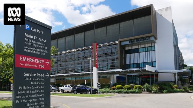 An outdoor sign pointing to a hospital's emergency department 