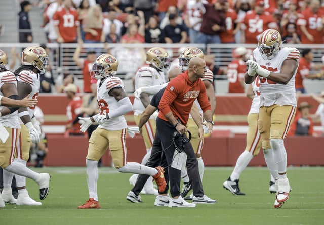 The defense and defensive coordinator Robert Saleh celebrate a missed field goal by the Jaguars in the second half as the San Francisco 49ers play the Jacksonville Jaguars at Levi’s Stadium on Sunday.