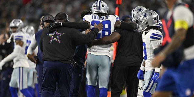 Dallas Cowboys safety Malik Hooker (28) is helped off the field in the second quarter against the Green Bay Packers at AT&T Stadium. Mandatory Credit: Jerome Miron-Imagn Images