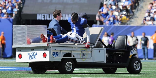Sep 28, 2025; East Rutherford, New Jersey, USA; New York Giants wide receiver Malik Nabers (1) is carted off the field following an injury during the second quarter against the Los Angeles Chargers at MetLife Stadium. Mandatory Credit: Brad Penner-Imagn Images
