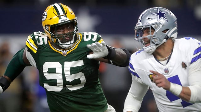 Green Bay Packers defensive tackle Devonte Wyatt (95) rushes Dallas Cowboys quarterback Dak Prescott (4) during the fourth quarter of their wild card playoff game Sunday, January 14, 2024 at AT&T Stadium in Arlington, Texas. Green Bay defeated Dallas 48-32.