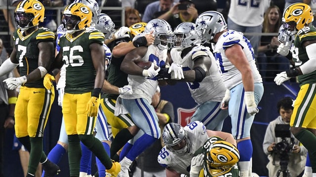 Sep 28, 2025; Arlington, Texas, USA; Dallas Cowboys running back Javonte Williams (33) scores a touchdown against the Green Bay Packers in the fourth quarter at AT&T Stadium. Mandatory Credit: Jerome Miron-Imagn Images
