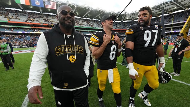 Sep 28, 2025; Dublin, Ireland; Pittsburgh Steelers coach Mike Tomlin (left), quarterback Aaron Rodgers (center) and defensive tackle Cameron Heyward (97) leave the field after an NFL International Series game against the Minnesota Vikings at Croke Park. Mandatory Credit: Kirby Lee-Imagn Images