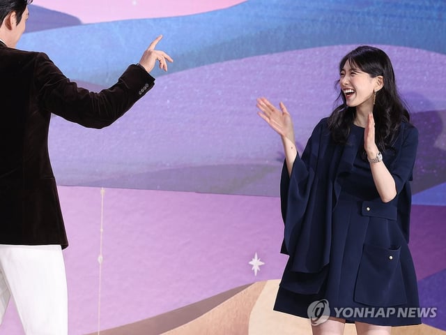 Bae Suzy (R) laughs during a press conference for "Genie, Make a Wish" in Seoul on Sept. 29, 2025. (Yonhap) 