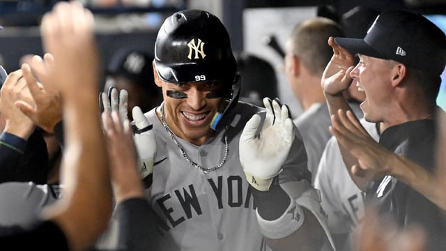 Aug 19, 2025; St. Petersburg, Florida, USA; New York Yankees designated hitter Aaron Judge (99) celebrates in the dugout after hitting a solo home run in the first inning against the Tampa Bay Rays at George M. Steinbrenner Field. Mandatory Credit: Jonathan Dyer-Imagn Images