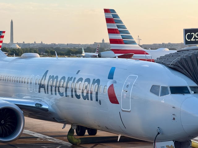An American Airlines passenger plane is parked at a gate at Ronald Reagan Washington National Airport, in Arlington, Virginia on August 24.