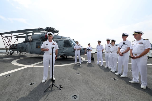 This photo, provided by Kookbangilbo, shows Captain Louis Catalina, commanding officer of the USS Blue Ridge, responding to reporters' questions during a press tour aboard a U.S. command ship on Sept. 29, 2025. (PHOTO NOT FOR SALE) (Yonahp)
