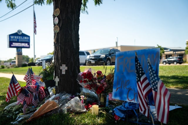 A memorial honors Charlie Kirk outside Wheeling High School on Sept. 16, 2025, in Prospect Heights. (Audrey Richardson/for the Chicago Tribune)