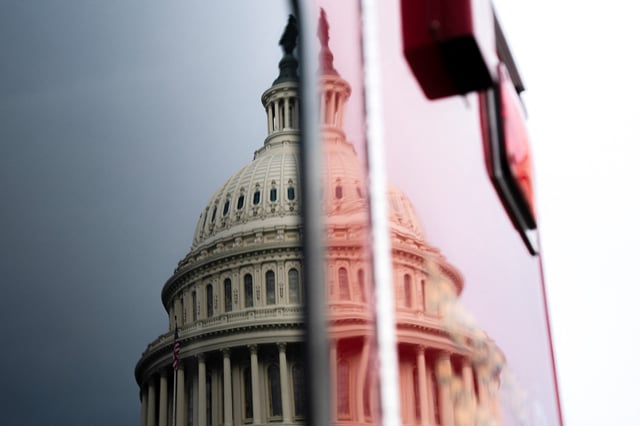 The U.S. Capitol is reflected on a surface, as a looming partial government shutdown is a week away if Congress fails to fund the government, on Capitol Hill in Washington, D.C., U.S., September 24, 2025. REUTERS/Nathan Howard
