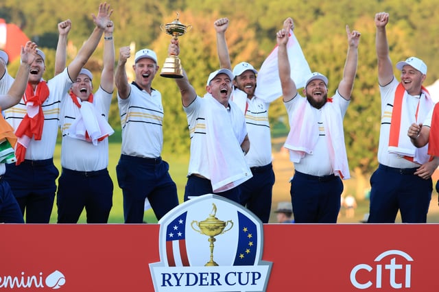 FARMINGDALE, NEW YORK - SEPTEMBER 28:  Rory McIlroy of Europe holds the Ryder Cup trophy aloft as Team Europe celebrate their 15-13 victory during the trophy presentation ceremony following the Sunday singles matches of the 2025 Ryder Cup at Black Course at Bethpage State Park Golf Course on September 28, 2025 in Farmingdale, New York. (Photo by David Cannon/Getty Images)