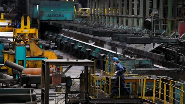Machinery and workers are seen at Algoma Steel Inc., in Sault Ste. Marie, Ont., on April 25. The federal government announced a $400-million financial support for Algoma Steel on Monday. 