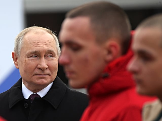 MOSCOW, RUSSIA - NOVEMBER 4 (RUSSIA OUT) Russian President Vladimir Putin (L) looks at participants during the ceremony, commemorating the National Unity Day, November 4,2023, in Moscow, Russia. Putin laid flowers at Moscow's Red Square, marking the national holyday, known as the Day of People's Unity, commemorates the popular uprising, which expelled Polish-Lithuanian occupation forces from Moscow by a militia in 1612.