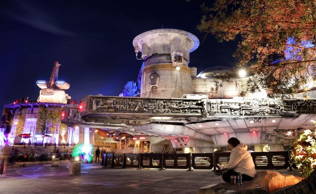 The immersive land of Stars Wars: Galaxy's Edge offers striking vistas for guests looking to lose themselves in the hyper-themed attraction at Disney's Hollywood Studios any time of day. But it is at night that the full impact of Black Spire Outpost's mountainous terrain flanking a desert spaceport on the fictitious planet of Batuu becomes the most stunning. The 14 acres of Stars Wars: Galaxy's Edge is the largest single themed-land expansion in Disney Parks history and opened on August 29, 2019. Photographed January 17, 2022. (Joe Burbank/Orlando Sentinel)