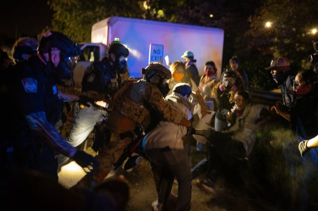 Protesters clash with ICE agents outside the U.S. Immigration and Customs Enforcement facility in Broadview, Sept. 26, 2025. (E. Jason Wambsgans/Chicago Tribune)
