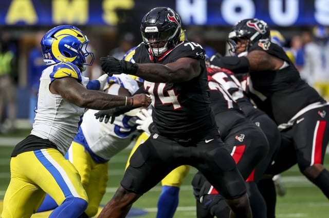 Sep 7, 2025; Inglewood, California, USA; Houston Texans offensive tackle Cam Robinson (74) blocks during the fourth quarter at SoFi Stadium. Mandatory Credit: Kiyoshi Mio-Imagn Images
