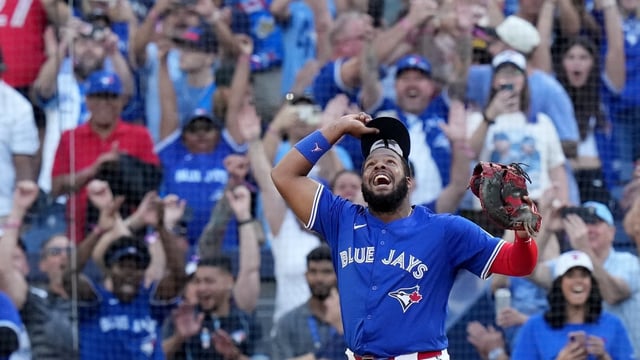 Toronto Blue Jays first baseman Vladimir Guerrero Jr. (27) celebrates as the team wins the American League East Division title in a victory over the Tampa Bay Rays in Toronto, Sunday. 