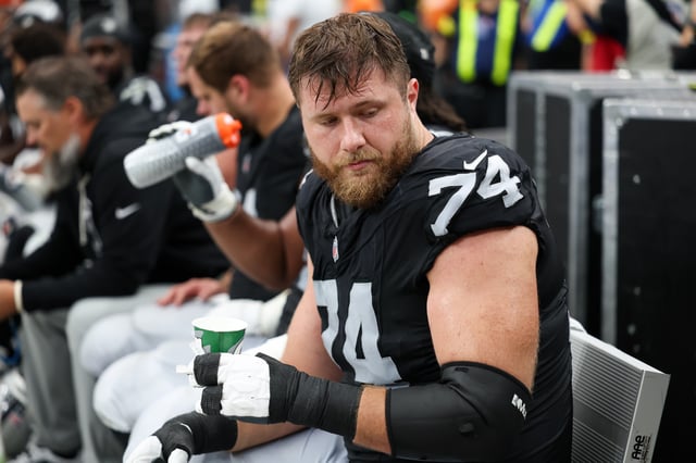 Sep 28, 2025; Paradise, Nevada, USA; Las Vegas Raiders offensive tackle Kolton Miller (74) drinks water from the sidelines during the second half against the Chicago Bears  at Allegiant Stadium. Mandatory Credit: Kiyoshi Mio-Imagn Images