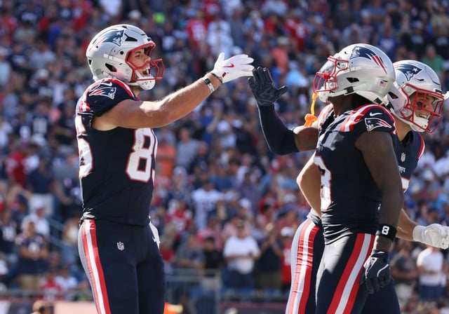 Foxboro, MA - New England Patriots' Hunter Henry celebrates his touchdown with Stefon Diggs during the third quarter of the game at Gillette Stadium. (Nancy Lane/Boston Herald)