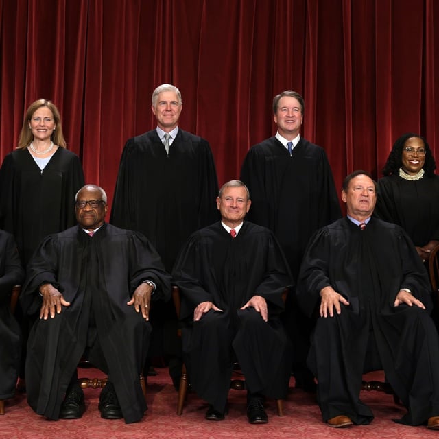 FILE - United States Supreme Court (front row L-R) Associate Justice Sonia Sotomayor, Associate Justice Clarence Thomas, Chief Justice of the United States John Roberts, Associate Justice Samuel Alito, and Associate Justice Elena Kagan, (back row L-R) Associate Justice Amy Coney Barrett, Associate Justice Neil Gorsuch, Associate Justice Brett Kavanaugh and Associate Justice Ketanji Brown Jackson pose for their official portrait at the East Conference Room of the Supreme Court building on October 7, 2022, in Washington, D.C. (Photo by Alex Wong/Getty Images)