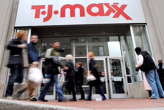 People walk past a TJ Maxx store in Boston.