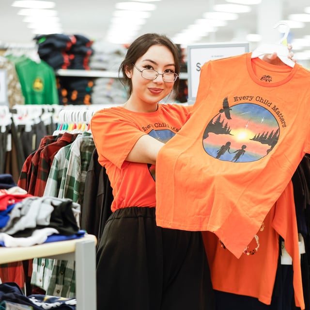 Brooklyn Rudolph, a Winnipeg designer selected by Walmart to create their Orange Shirt Day design, at a Walmart in Winnipeg, Manitoba Wednesday, Sept. 24, 2025. Companies are selecting indigenous designers to create their Orange Shirt Day products.