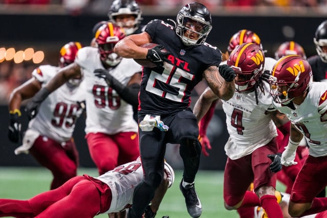 Atlanta Falcons running back Tyler Allgeier (25) runs the ball during the second half of an NFL football game against the Washington Commanders, Sunday, Sep. 28, 2025, in Atlanta. (AP Photo/Danny Karnik)