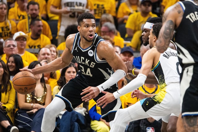 Apr 29, 2025; Indianapolis, Indiana, USA; Milwaukee Bucks forward Giannis Antetokounmpo (34) dribbles  the ball while Indiana Pacers forward Jarace Walker (5)  defends during game five of the first round for the 2024 NBA Playoffs at Gainbridge Fieldhouse. Mandatory Credit: Trevor Ruszkowski-Imagn Images/ File Photo