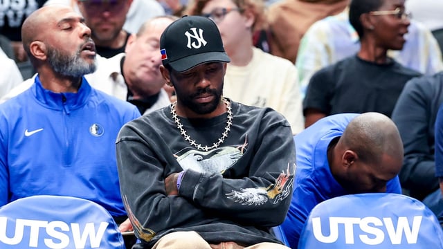 Mar 16, 2025; Dallas, Texas, USA; Dallas Mavericks guard Kyrie Irving sits on the bench against the Philadelphia 76ers during the first half at American Airlines Center. Mandatory Credit: Kevin Jairaj-Imagn Images