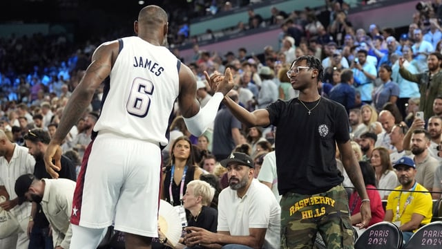 Aug 8, 2024; Paris, France; United States guard LeBron James (6) shakes hands with son Bryce James against Serbia in a men's basketball semifinal game during the Paris 2024 Olympic Summer Games at Accor Arena. Mandatory Credit: Kyle Terada-Imagn Images