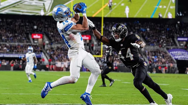 Detroit Lions wide receiver Amon-Ra St. Brown (14) makes a catch for a touchdown against Baltimore Ravens cornerback Marlon Humphrey (44) during the second half at M&T Bank Stadium in Baltimore, Md. on Monday, Sept. 22, 2025.