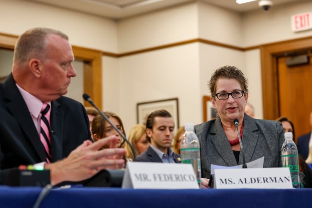 Steve Federico, left, looks on as Mia Alderman testifies about the murder of her granddaughter Mary Santina Collins during the House Judiciary Subcommittee on Oversight holds a field hearing on violent crime in Charlotte, N.C., Monday, Sept. 29, 2025. (AP Photo/Nell Redmond)