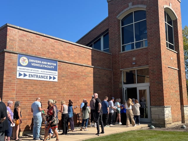 Customers wait outside the new Orland Park motor vehicle services facility Sept. 29, 2025 at 18230 Orland Parkway, which will offer expanded hours and additional services. The new temporary location replaces the one in Orland Township. (Michelle Mullins/for the Daily Southtown)