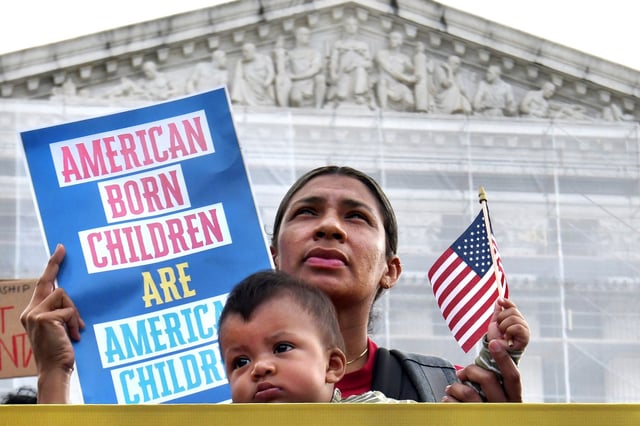 Olga Urbina and her 9-month old baby Ares Webster, with other protesters as arguments are heard regarding President Donald Trump's proposed policy to end birthright citizenship at the Supreme Court on May 15, 2025.