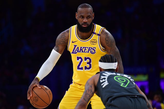 Apr 30, 2025; Los Angeles, California, USA; Los Angeles Lakers forward LeBron James (23) controls the ball against Minnesota Timberwolves guard Nickeil Alexander-Walker (9) during the first half in game five of first round for the 2025 NBA Playoffs at Crypto.com Arena. Mandatory Credit: Gary A. Vasquez-Imagn Images/ File Photo
