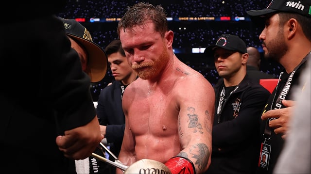 Canelo Alvarez gets the tape cut off his gloves after a loss to Terence Crawford. Credit: Sarah Stier/Getty Images