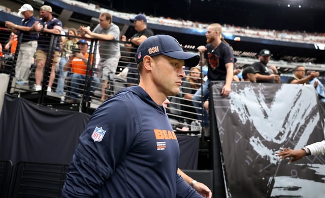 Bears coach Ben Johnson walks onto the field before a game against the Raiders on Sunday, Sept. 28, 2025, at Allegiant Stadium in Las Vegas. (Chris Sweda/Chicago Tribune)