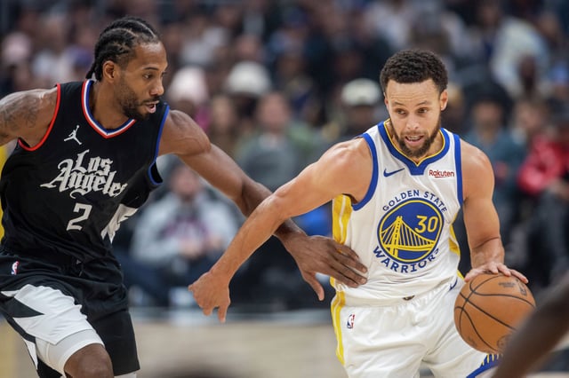 Los Angeles Clippers forward Kawhi Leonard defends Golden State Warriors guard Stephen Curry in the first half of an NBA basketball game between the Golden State Warriors and Los Angeles Clippers, Saturday, Dec. 2, 2023, at Crypto.com Arena in Los Angeles.