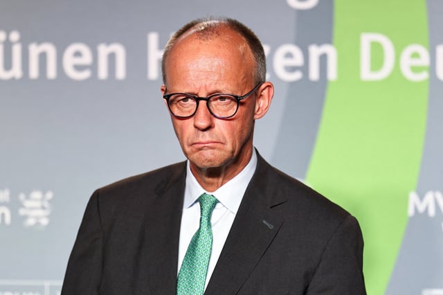 German Chancellor Friedrich Merz attends a press confernce, as he meets with eastern German state premiers, at Ettersburg Castle, in Ettersburg, Germany, September 25, 2025. REUTERS/Karina Hessland