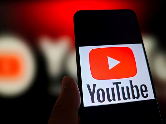 An illustration photo shows YouTube logo in a smartphone.