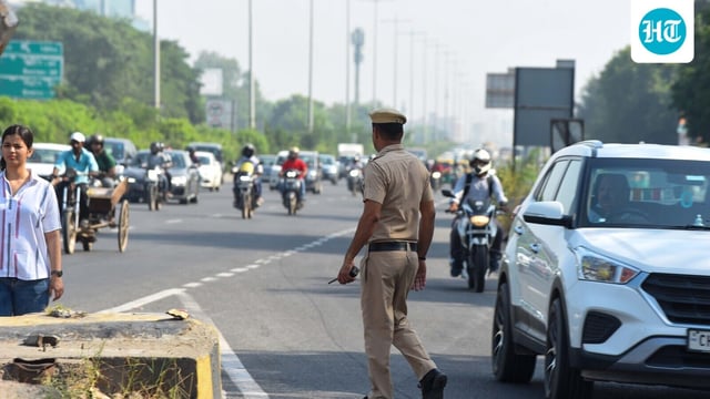 Police investigating the spot where a black Mahindra Thar collided with a divider on the Delhi-Gurugram Expressway in Gurugram. (Photo by Parveen Kumar/Hindustan Times)