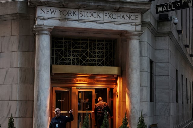 A man walks into the New York Stock Exchange (NYSE) building in New York City, U.S., March 11, 2025. REUTERS/Shannon Stapleton/File Photo