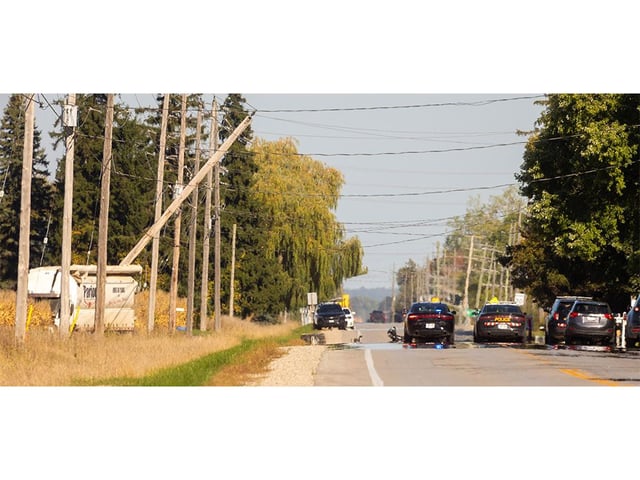 After a collision on Medway Road, a truck is in a cornfield on the north side of the road, while a heavily damaged vehicle is reported in the trees on the south side, though it isn’t visible. Photograph taken on Monday, Sept. 29, 2025. (Mike Hensen/The London Free Press) 